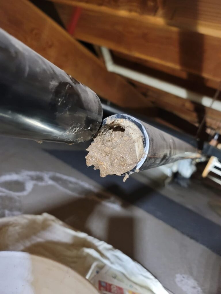 Clogged pipe need of plumbing repair